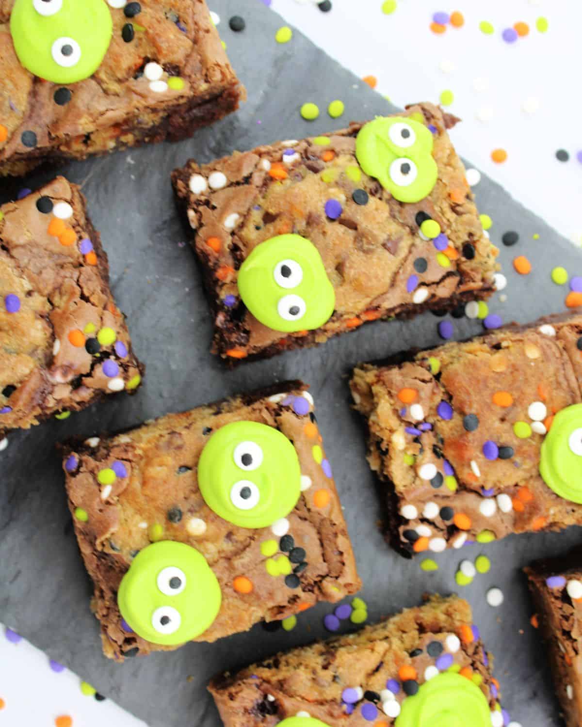 Halloween Monster brownies with green monster faces and sprinkles. 