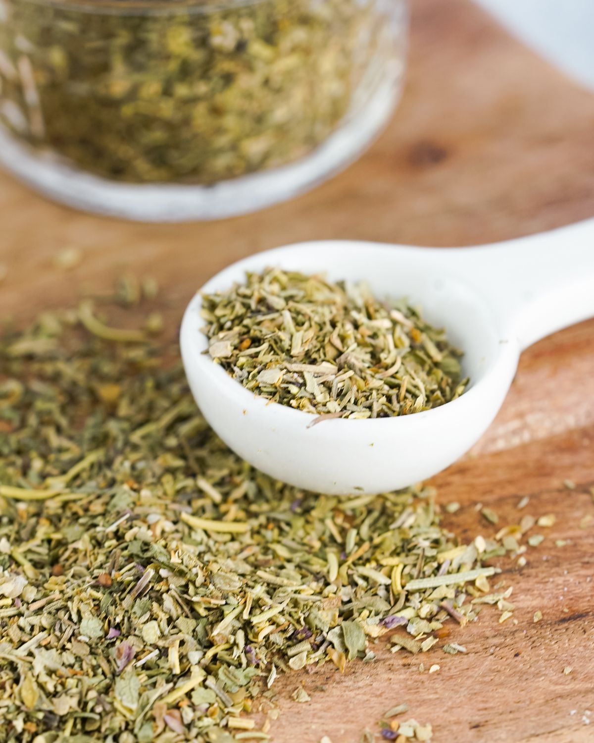 Seasonings on a cutting board for Italian Seasoning.