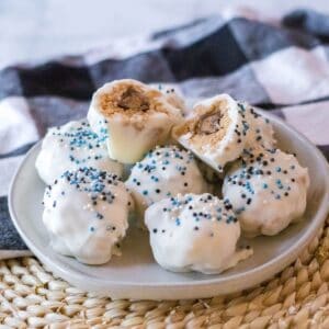 A plate of rice krispy peanut butter no bake balls.