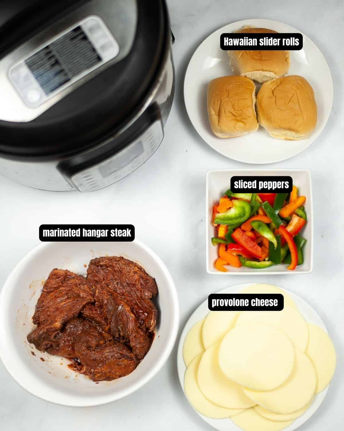 Ingredients with text overlay to create philly cheesesteaks.