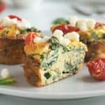 low-carb egg muffins filled with spinach, tomato, and feta.
