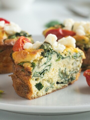 low-carb egg muffins filled with spinach, tomato, and feta.