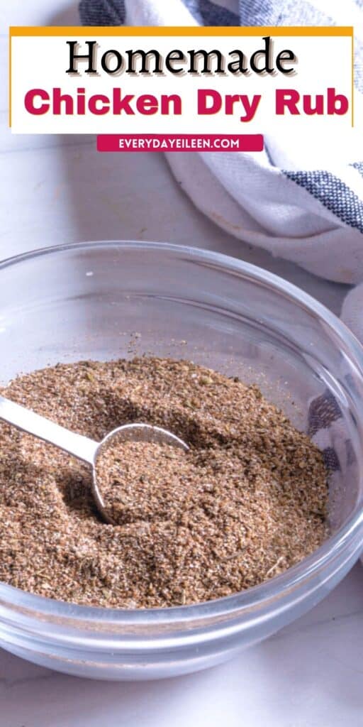 A glass bowl with spices and a whisk in the bowl.