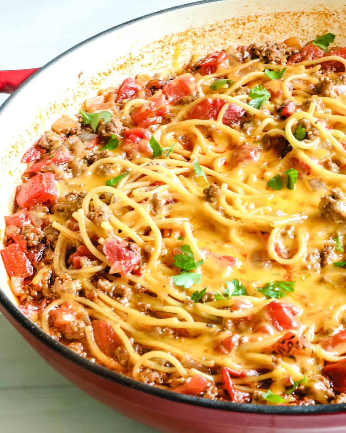 A one pot taco spaghetti in a large skillet. 