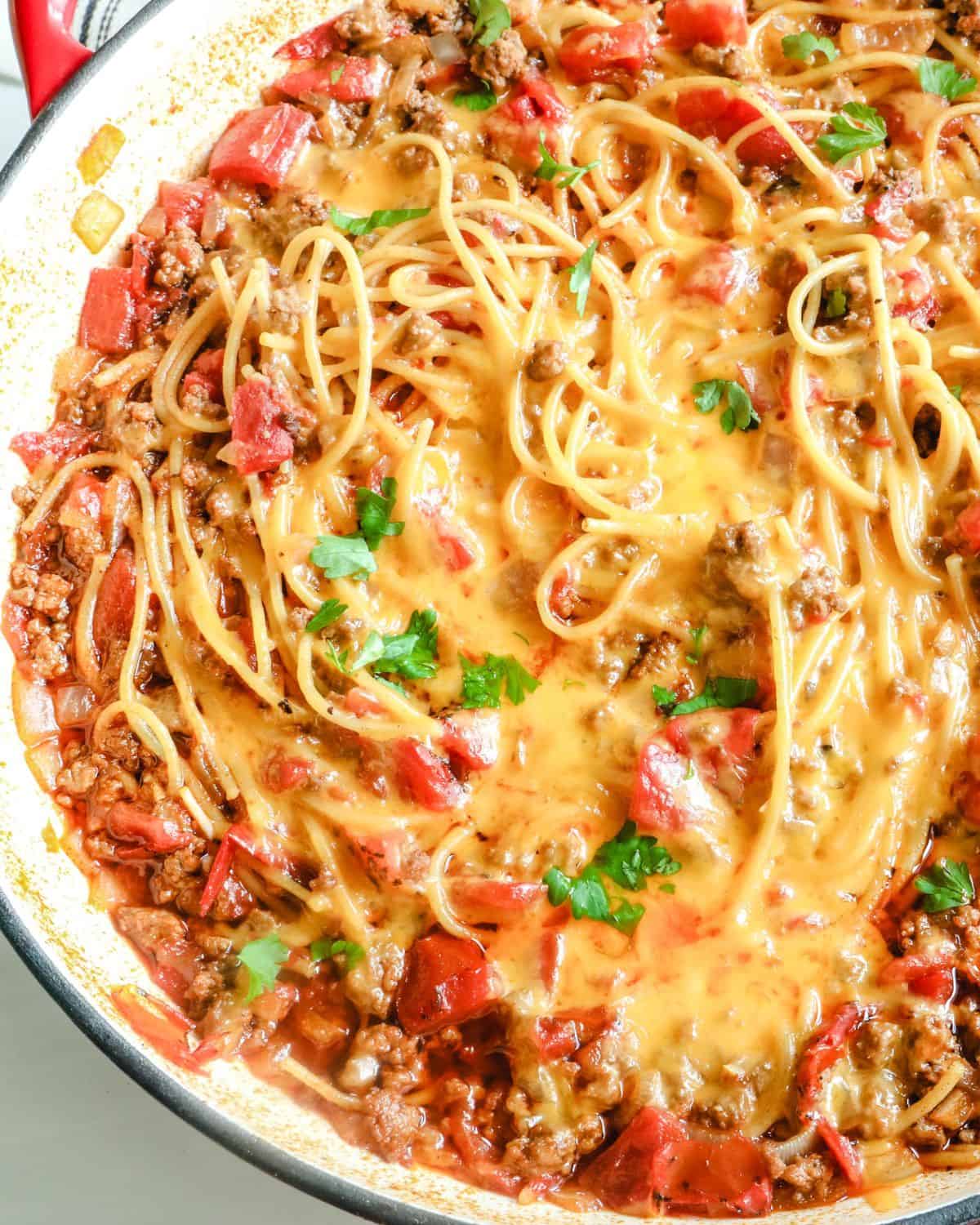An overhead view of taco spaghetti on a skillet.