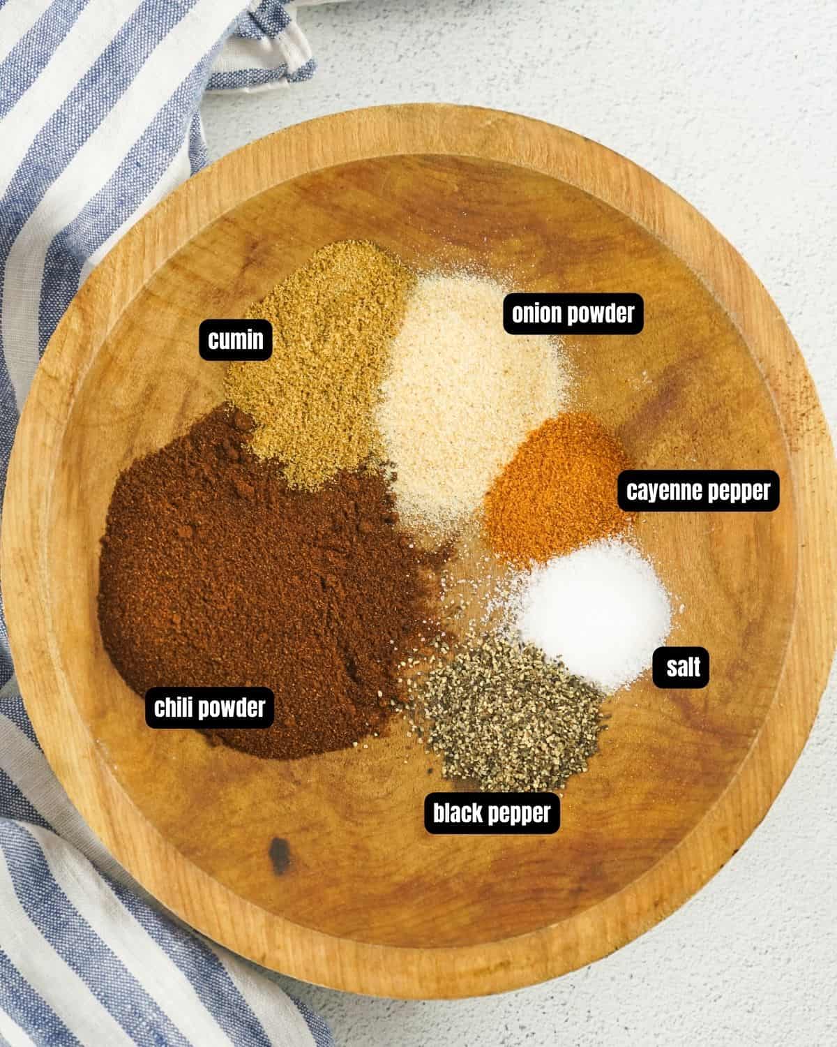 chipotle chili seasoning ingredients in a wooden bowl. 