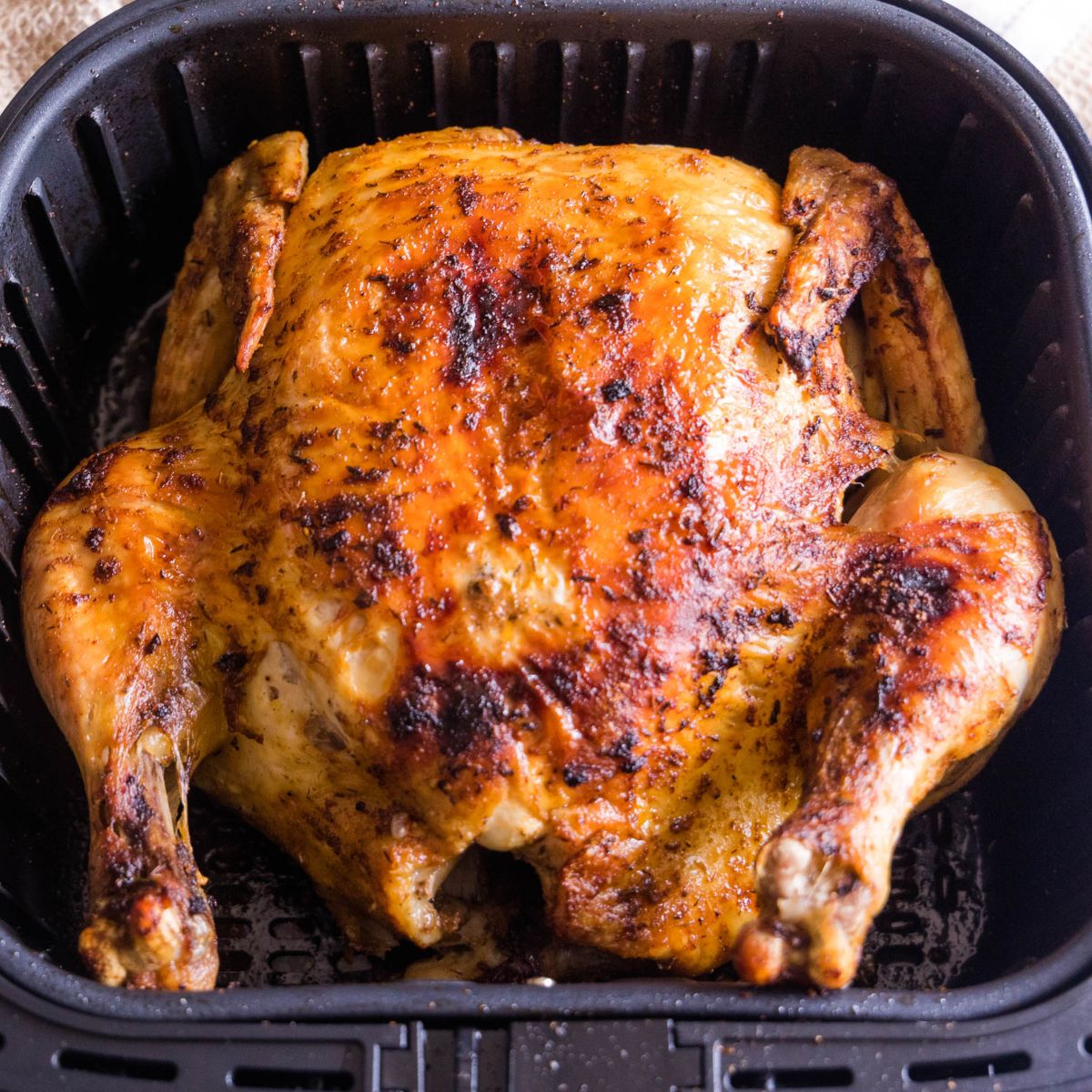 https://www.everydayeileen.com/wp-content/uploads/2023/01/air-fryer-whole-chicken-rotisserie-style.jpg