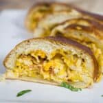 bacon chicken ranch Stromboli sliced on a plate.