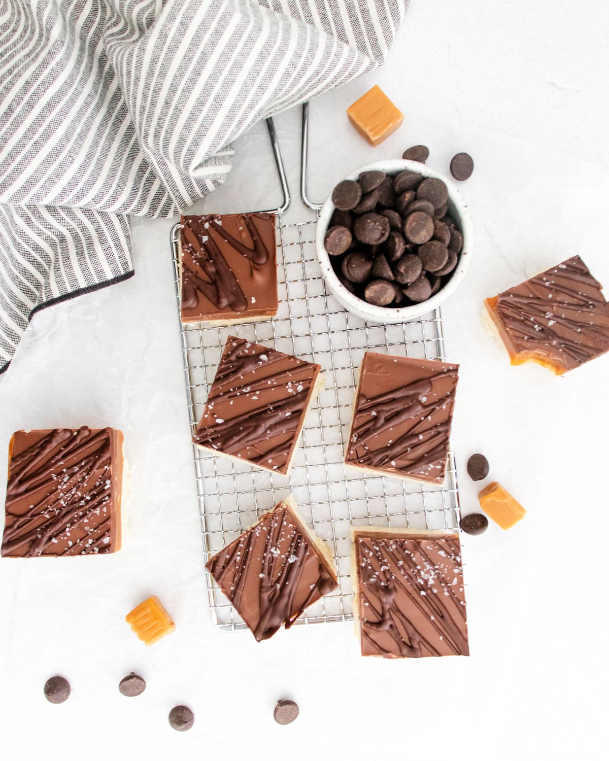 An overhead view of copycat twix bar candies on a wire rack.