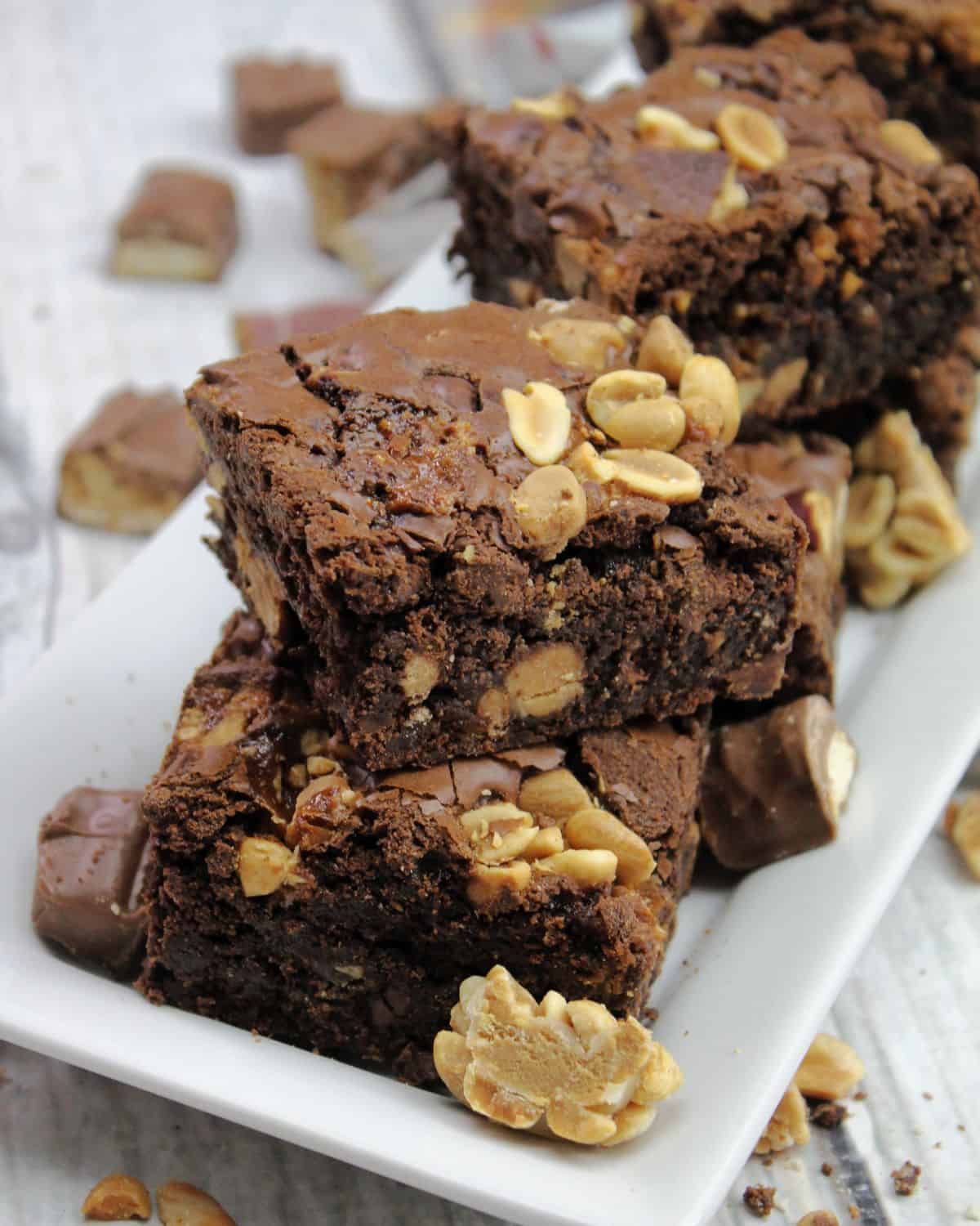 Candy bar brownies on a plate.