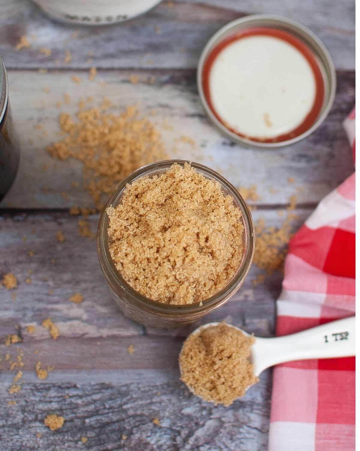 An overhead view of a mason jar filled with homemade brown sugar. 