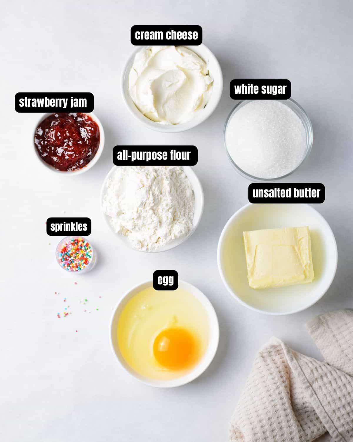 Ingredients with text overlay to make cheesecake cup cookies. 