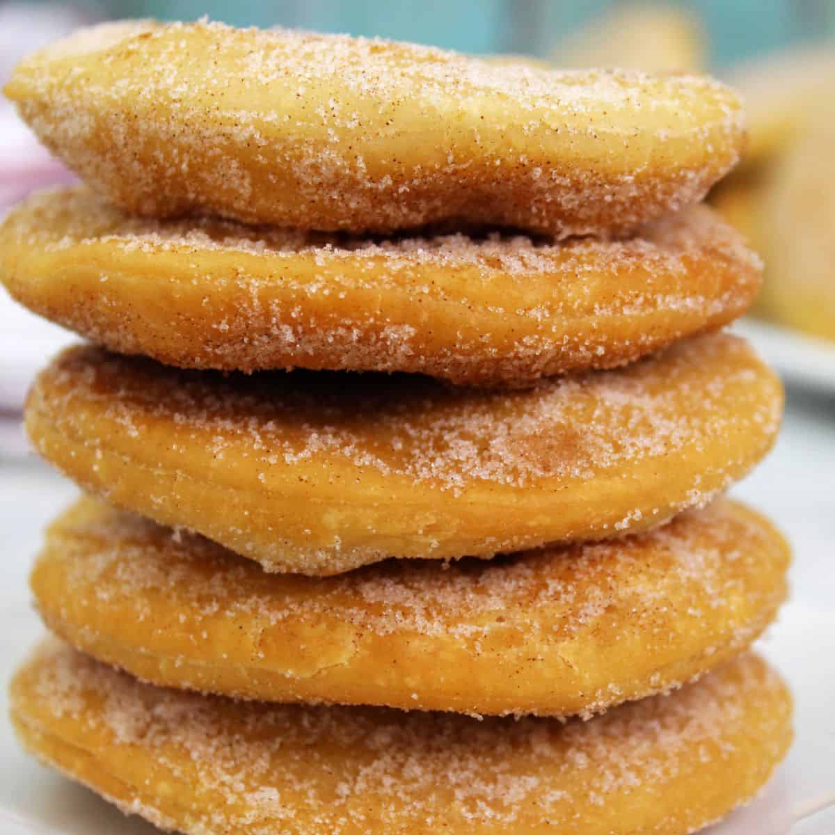 A stack of bunuelos on a plate.