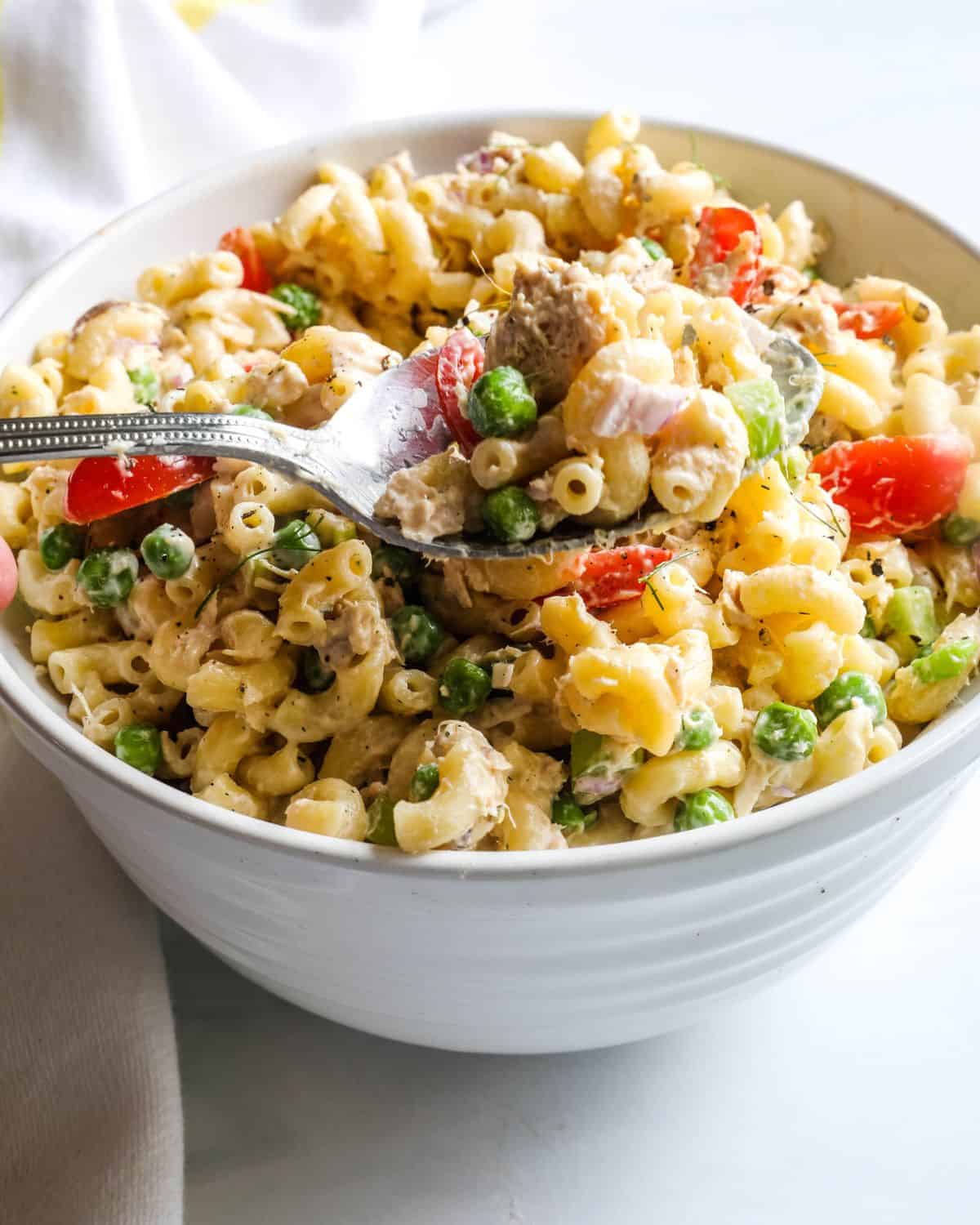 A cold tuna salad with pasta and a creamy sauce.