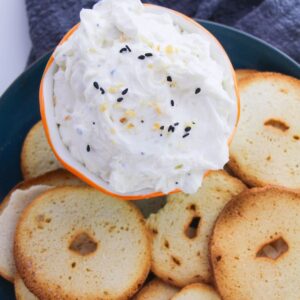 Everything but the bagel dip in a bowl with bagel chips.