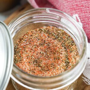 A glass mason jar filled with a steak seasoning rub made from scratch.
