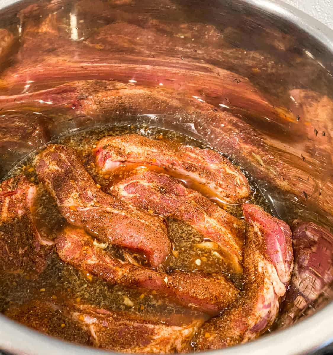 Asian Sticky ribs in the instant pot vessel.