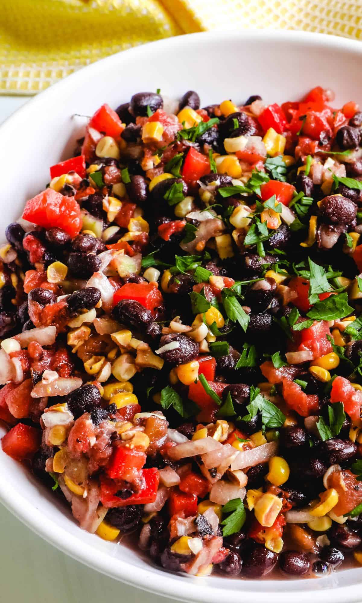 Easy bean salad with corn topped with cilantro.