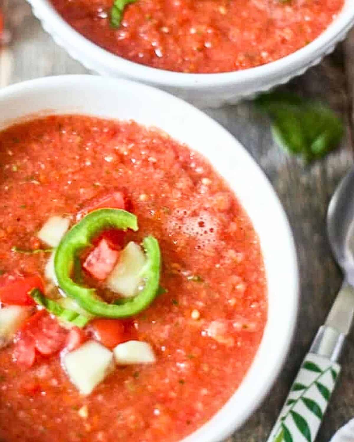 Two bowls of gazpacho soup.