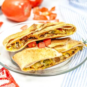 An air fryer copycat crunchwrap supreme in a plate.