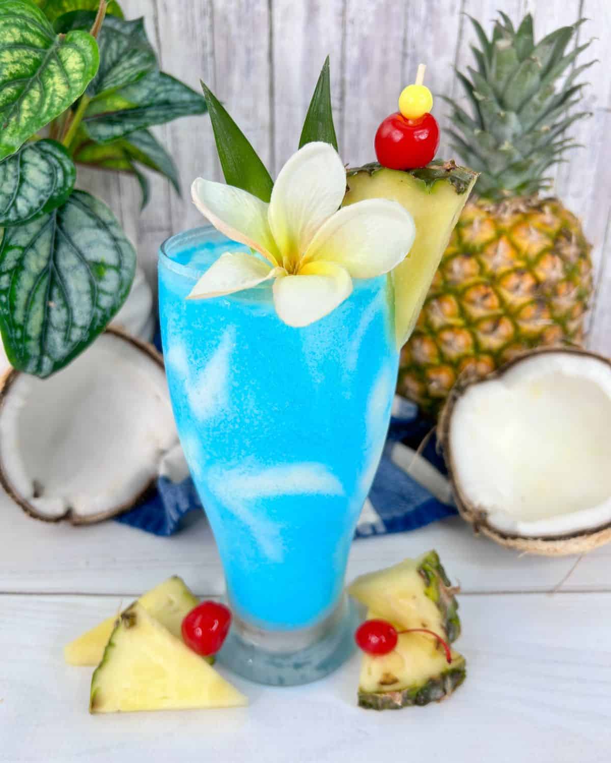 Blue frozen pina colada in a clear glass.