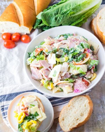 Hoagie Dip with cold cuts, lettuce, and banana peppers to make an Italian salad spread.