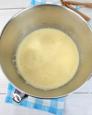 Eggs that have been whipped to make a yellow swiss roll cake.