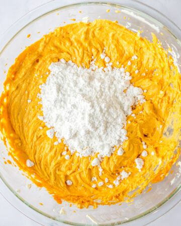 Another step to make no bake pumpkin cheese cake with whipped cream and pumpkin puree topped with confectioners sugar. 