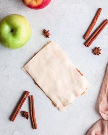 Puff pastry filled with apple filling to make puff pastry twists.