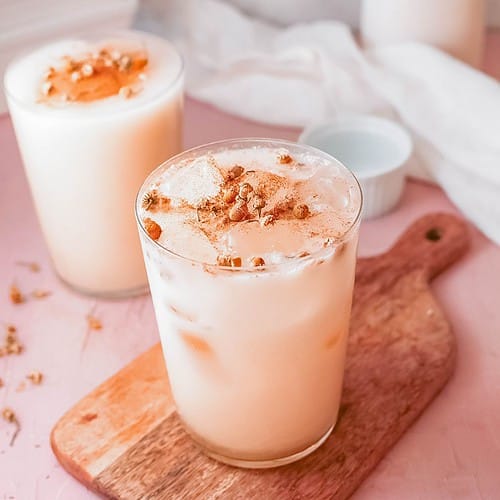 Iced chamomile latte in glasses made with milk and topped with cinnamon.