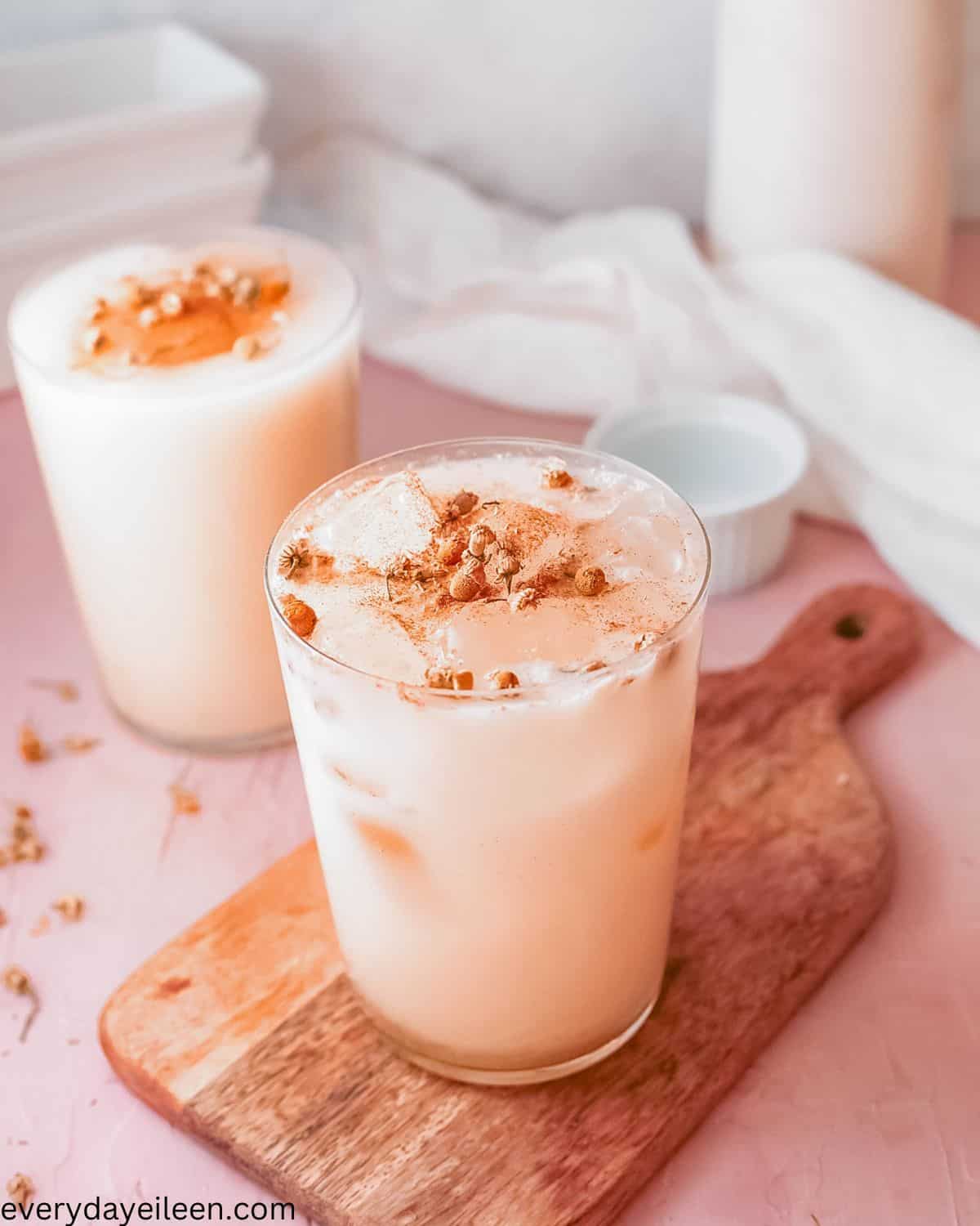 Iced chamomile latte in glasses made with milk and topped with cinnamon.