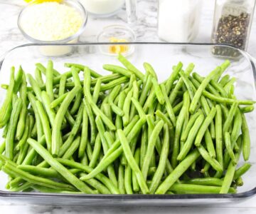 Green beans in a glass casserole dish.