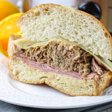 A half sandwich of a Cuban pork sandwich made in the slow cooker.