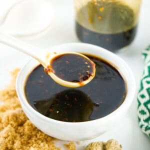 Homemade Teriyaki Sauce in a bowl being spooned up from the bowl.