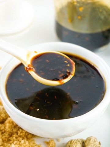 Homemade Teriyaki Sauce in a bowl being spooned up from the bowl.