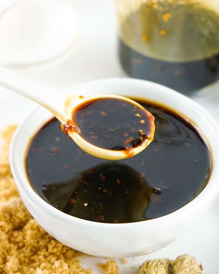 Homemade Teriyaki Sauce in a bowl being spooned up from the bowl.