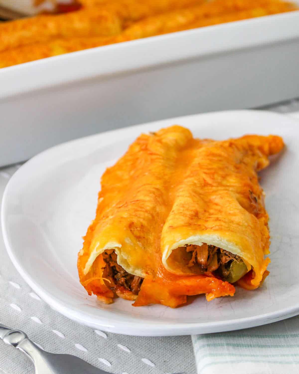 Shredded beef enchiladas made with leftover beef topped with cheese.