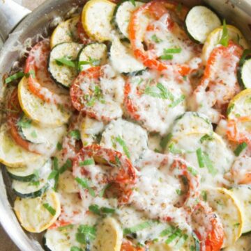 Zucchini, tomato, eggplant bake in a large pan.