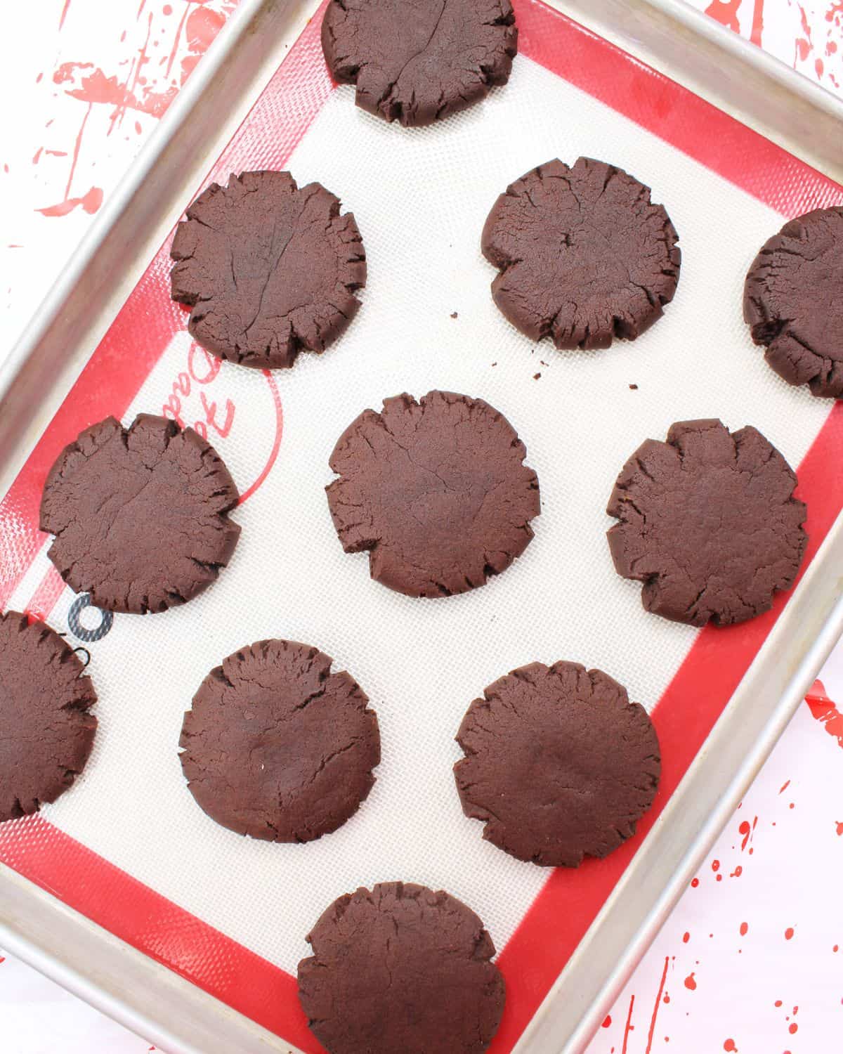 Chocolate cookies on a baking sheet.