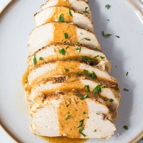 Slow cooker turkey made in the slow cooker topped with gravy.