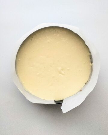A springform pan with cheesecake in the pan.