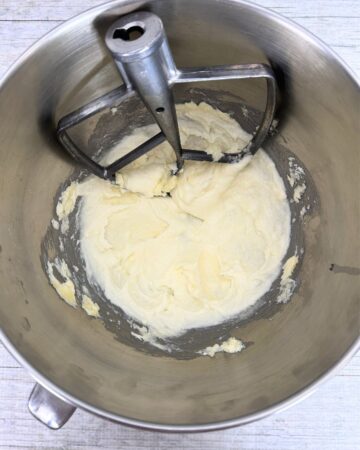 A stand mixer bowl with batter to make lofthouse cookies.