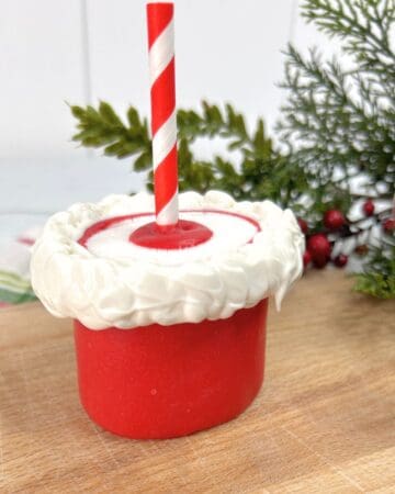 A marshmallow decorated for Christmas in the process of being made.