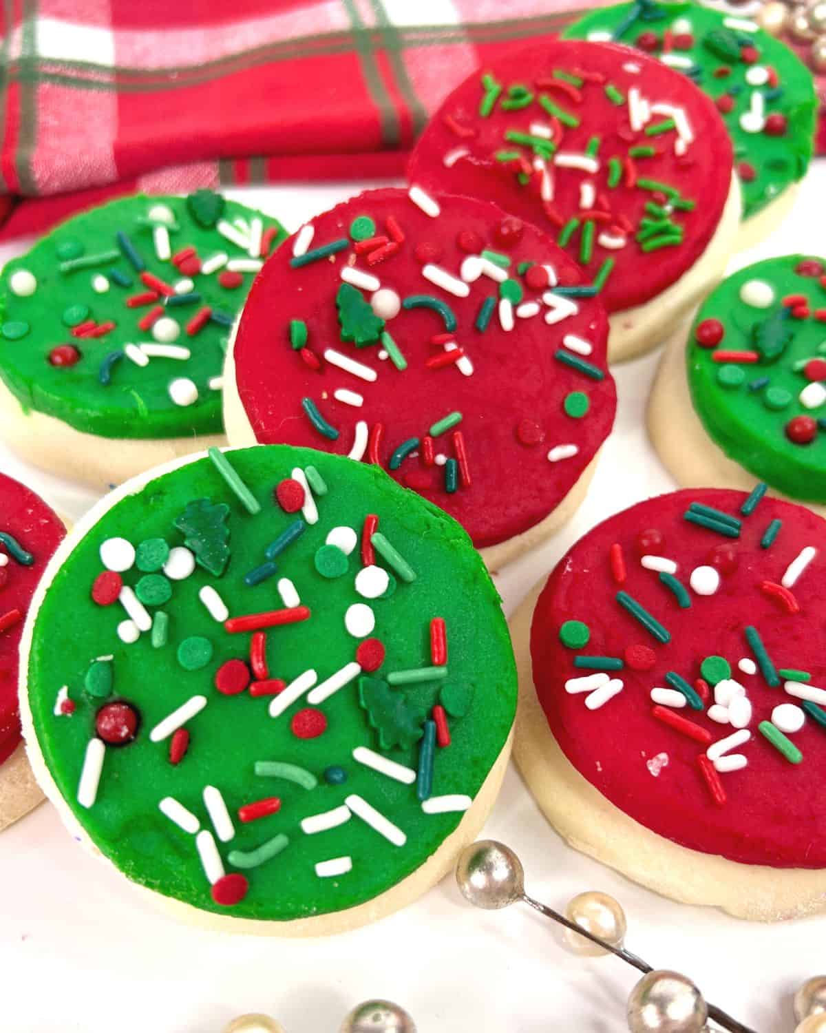 Holiday lofthouse cookies with red and green frosting and sprinkles