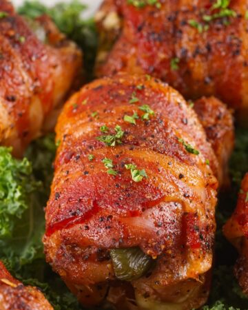 Smoked boneless chicken thighs stuffed with creamy jalapeno popper filling and wrapped with bacon. 