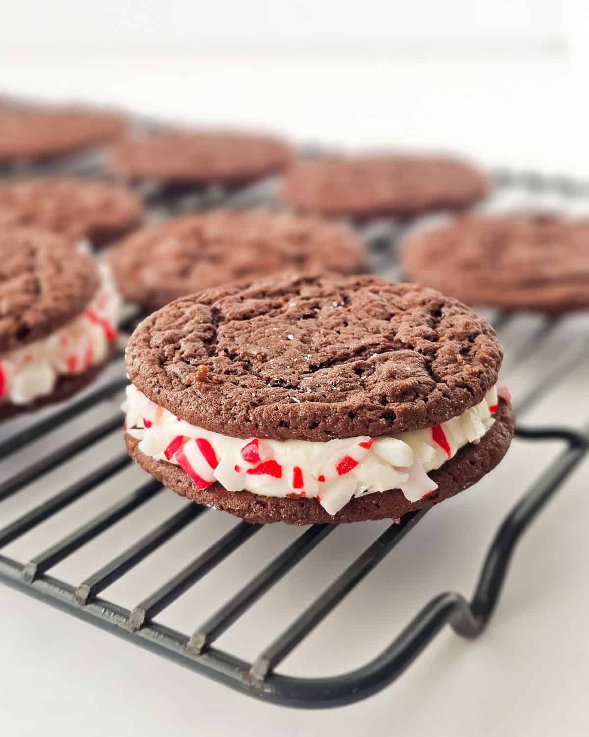 Peppermint chocolate cake mix cookies with crushed candy canes on the side.