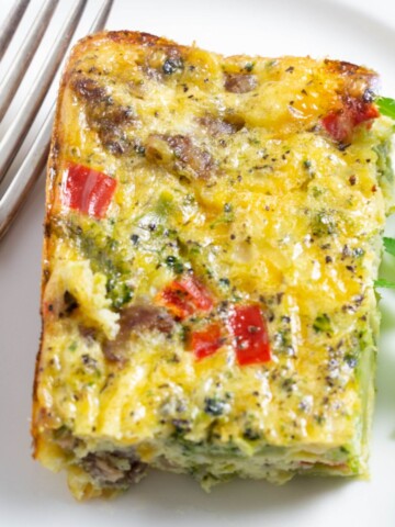 Cheesy sausage egg casserole with broccoli and red peppers.