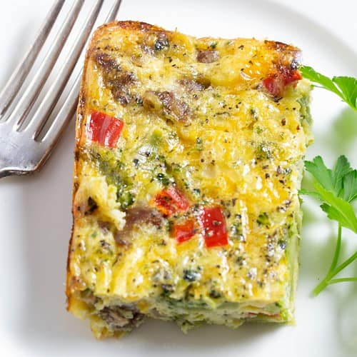 Cheesy sausage egg casserole with broccoli and red peppers.