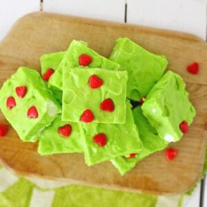 Grinch fudge candy with red hearts on the fudge.