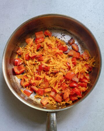 Sauteed peppers and carrots to make a teriyaki pork noodle recipe.